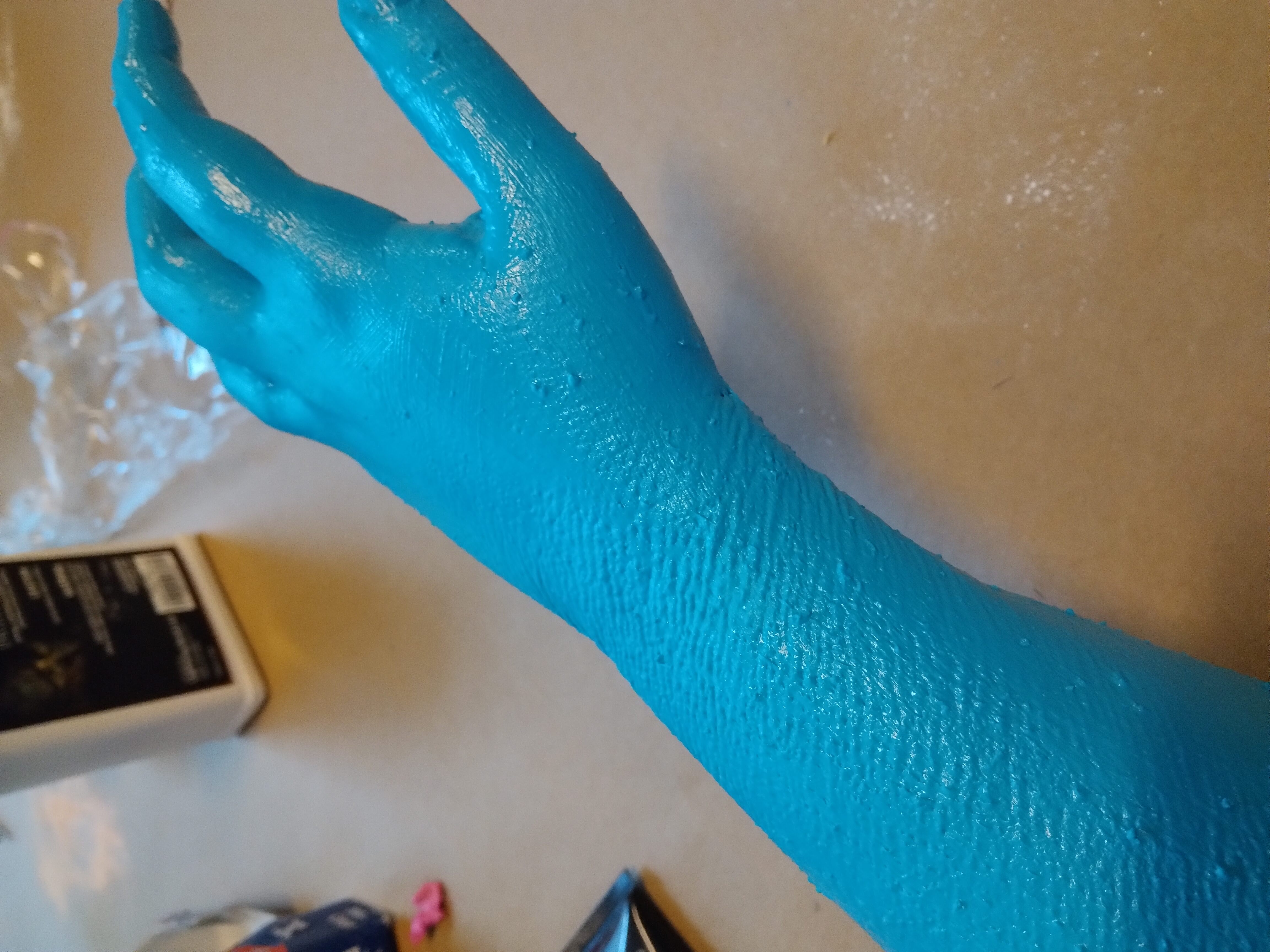 Winter 2022: Constructed a fake arm using liquid latex. Began by powdering and painting my arm with liquid latex colored with acrylic paint.